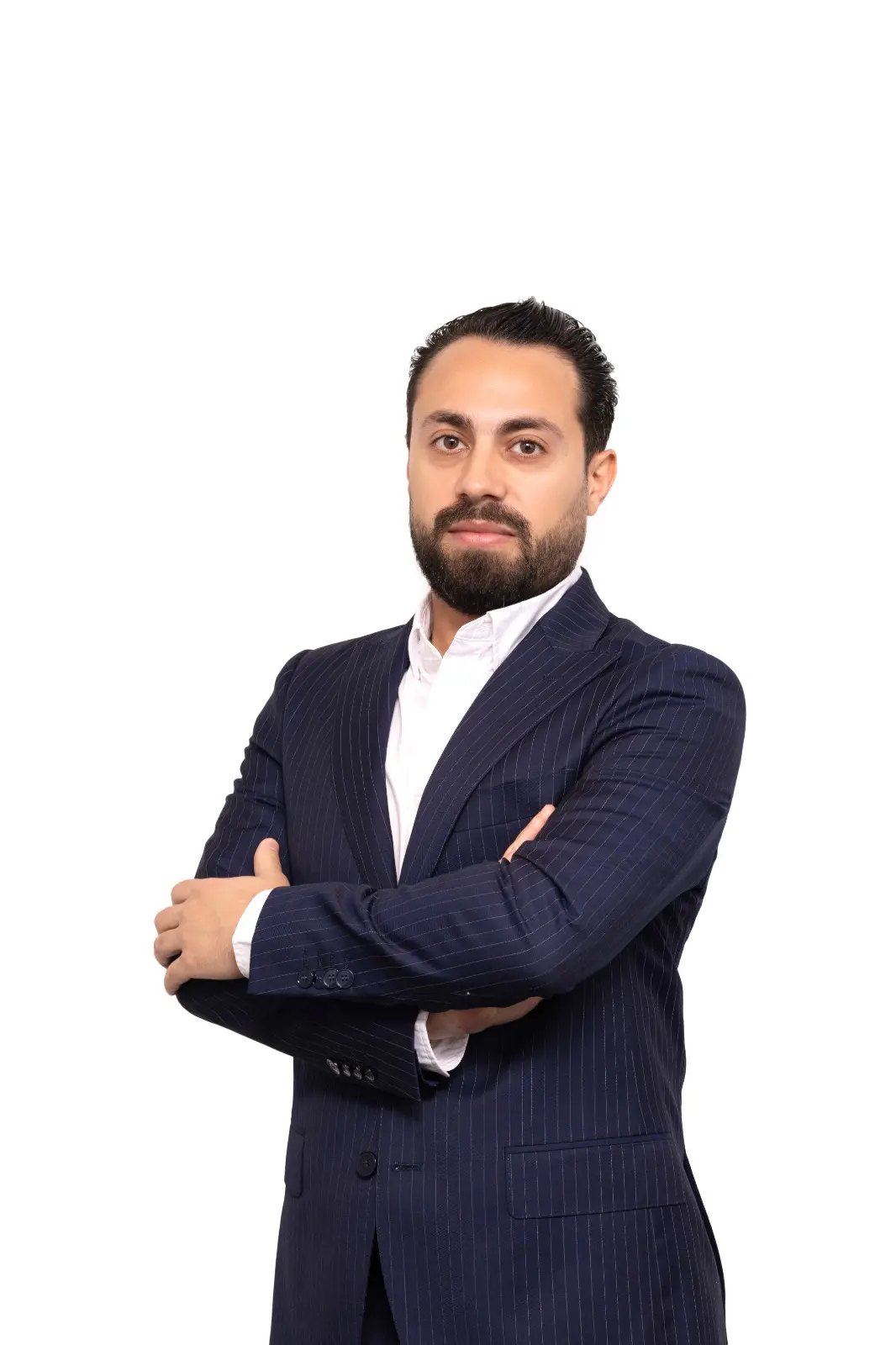 Portrait of Kinan Sheikh El Hara in a dark suit